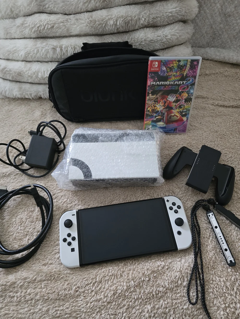 Nintendo Switch OLED Console with White Joy‑Cons and Mario Kart 8 Deluxe